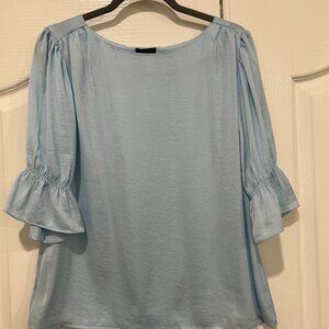 Pale blue blouse with puffed sleeves
